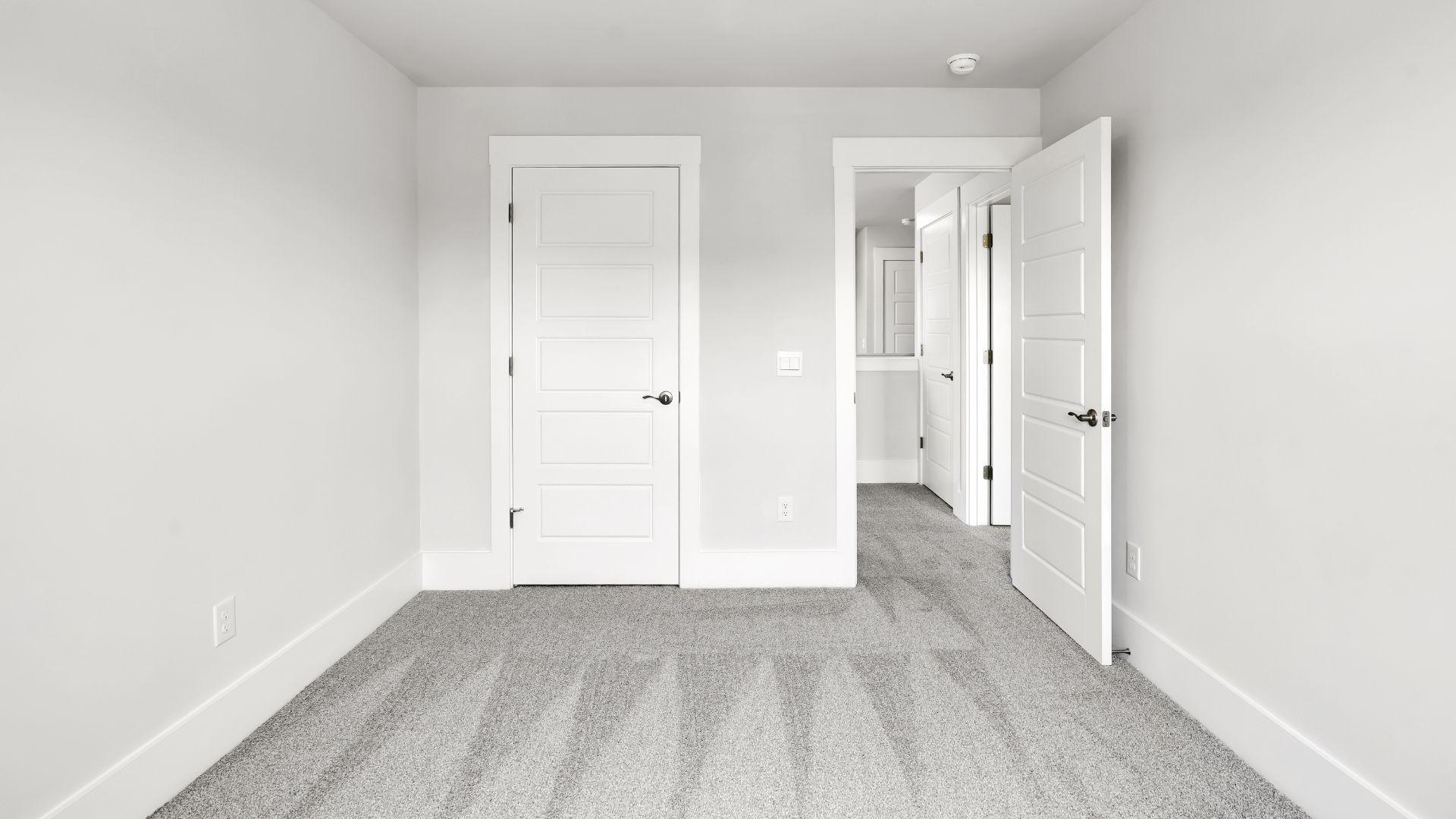 Upstairs this home also features a primary suite, complete with a large walk-in closet and en suite bathroom featuring dual vanities and a spacious shower. The additional three bedrooms share a full bath that includes dual vanities.
