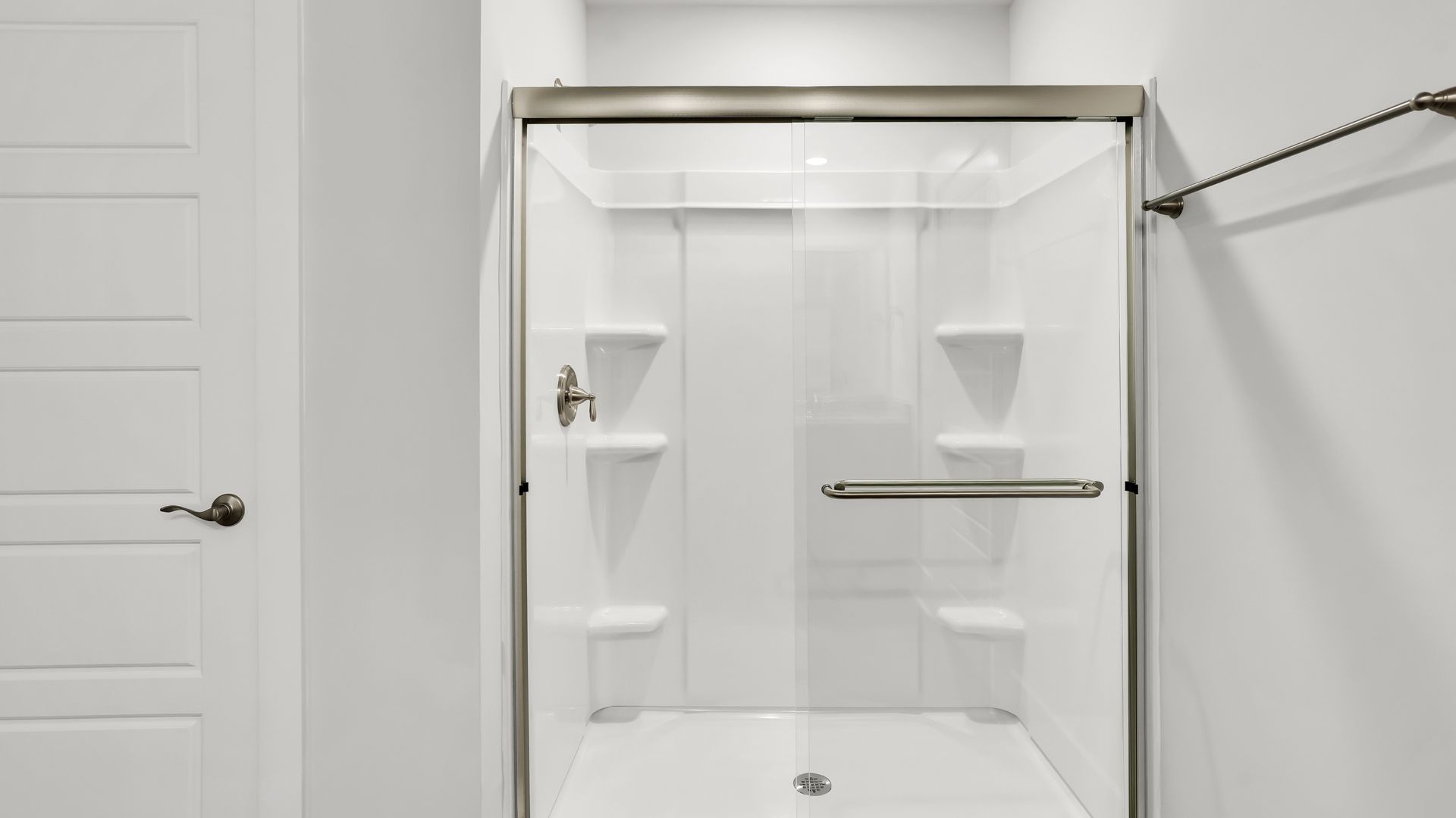Upstairs this home also features a primary suite, complete with a large walk-in closet and en suite bathroom featuring dual vanities and a spacious shower. The additional three bedrooms share a full bath that includes dual vanities.