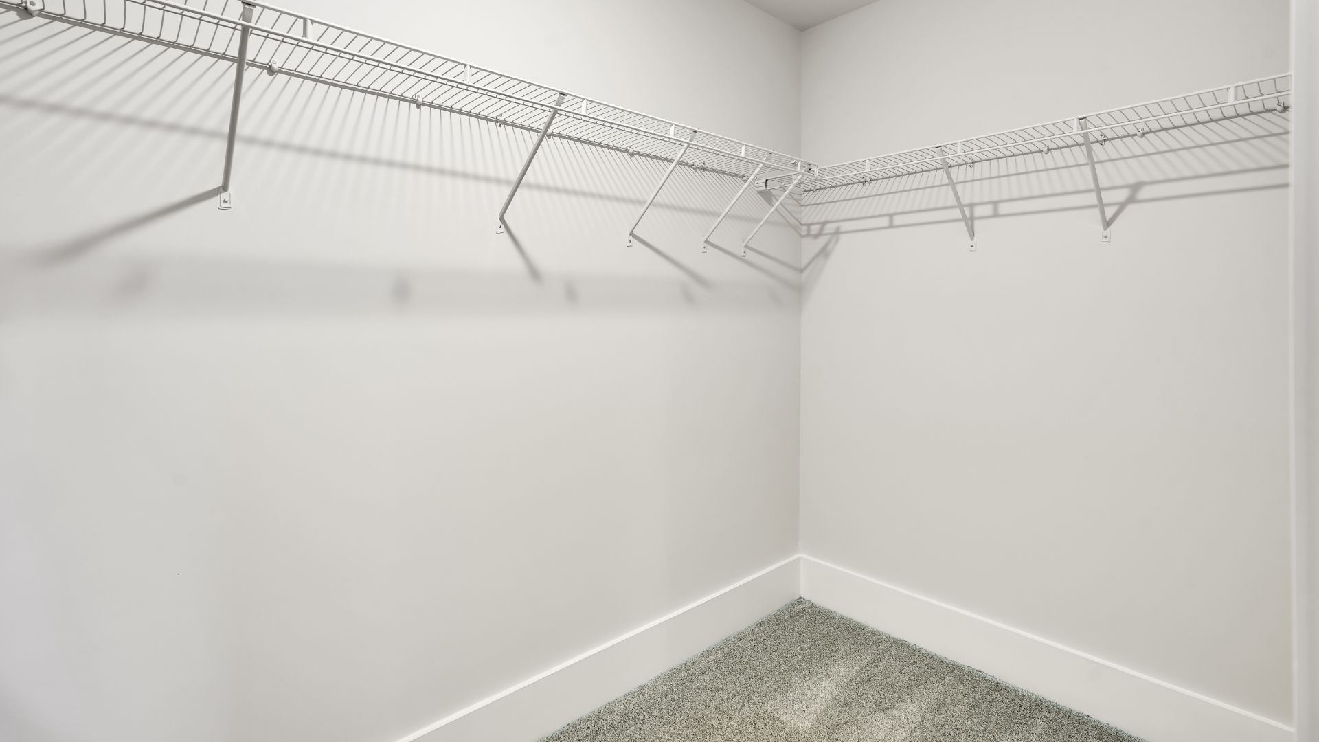 Upstairs this home also features a primary suite, complete with a large walk-in closet and en suite bathroom featuring dual vanities and a spacious shower. The additional three bedrooms share a full bath that includes dual vanities.