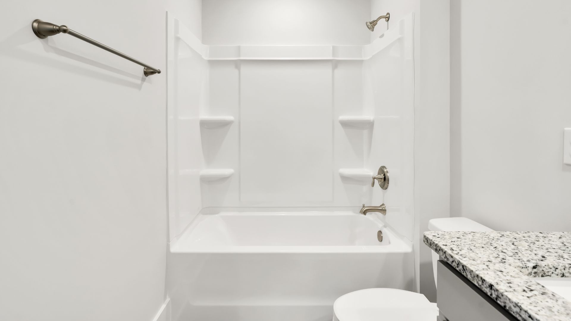 Upstairs this home also features a primary suite, complete with a large walk-in closet and en suite bathroom featuring dual vanities and a spacious shower. The additional three bedrooms share a full bath that includes dual vanities.