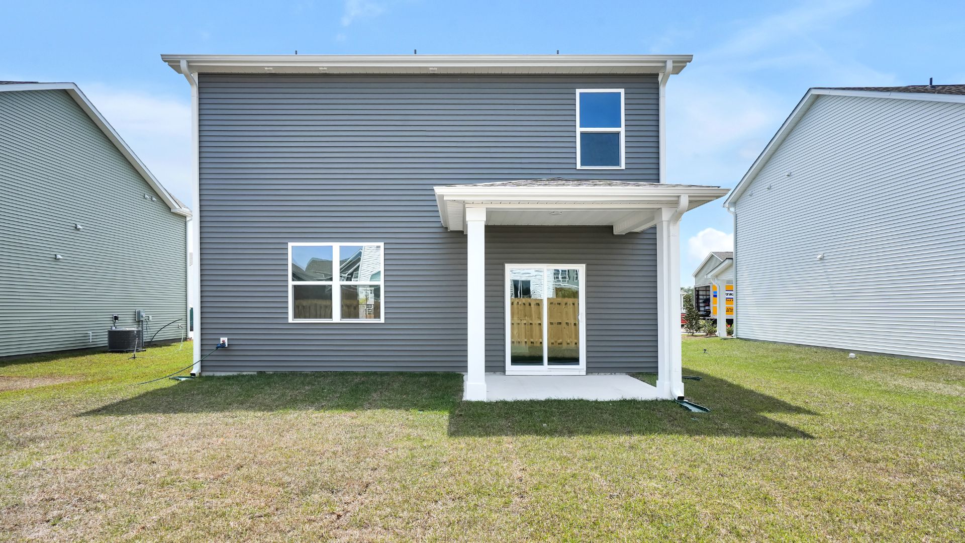Out back is a covered patio, perfect for outdoor entertaining or enjoying beautiful weather.