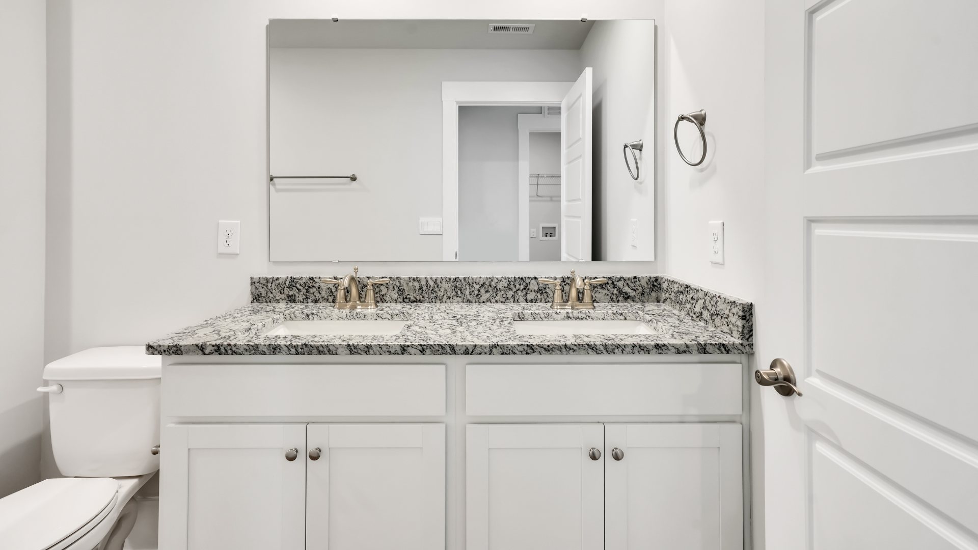 There are an additional three bedrooms, full bath and laundry room.