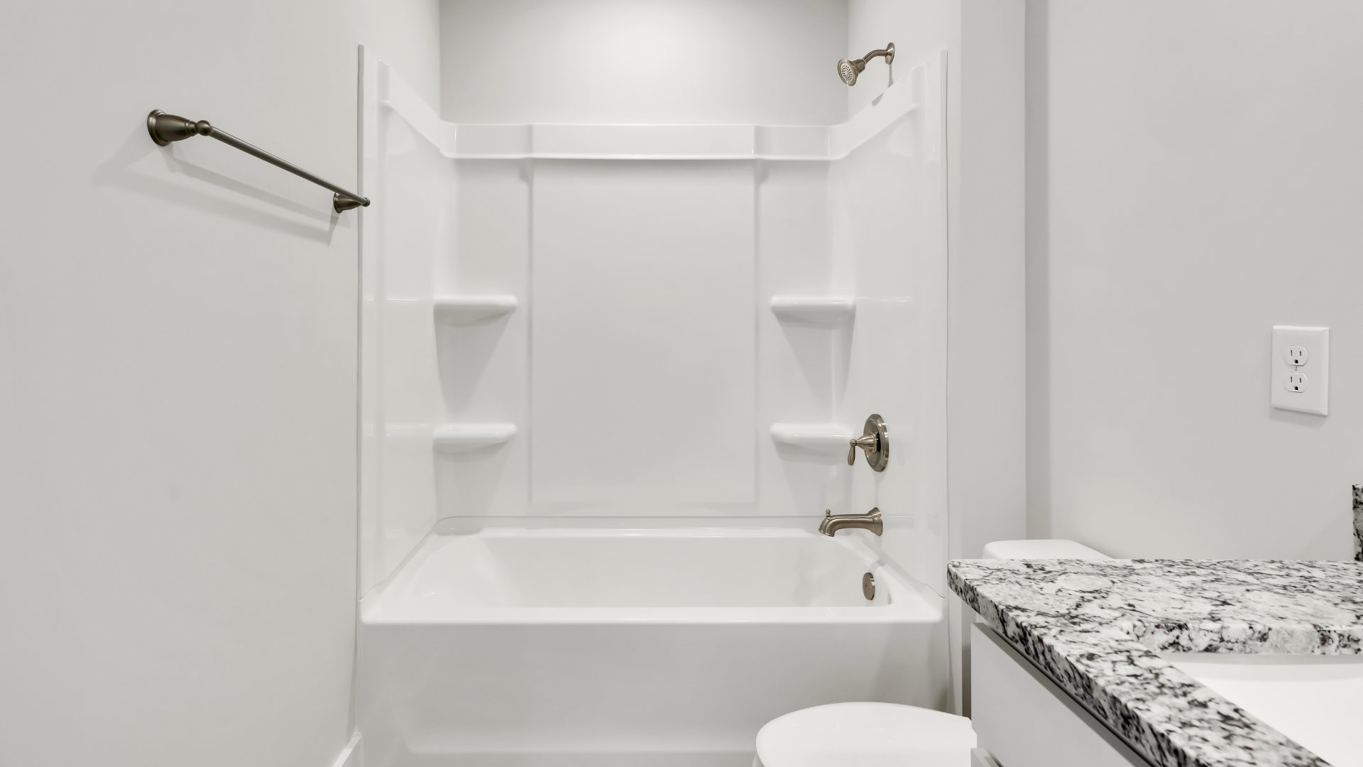 There are an additional three bedrooms, full bath and laundry room.