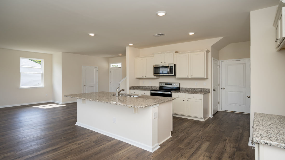 The kitchen features 36" cabinets, granite countertops, and stainless steel appliances, which are sure to both turn heads and make meal prep easy. Y