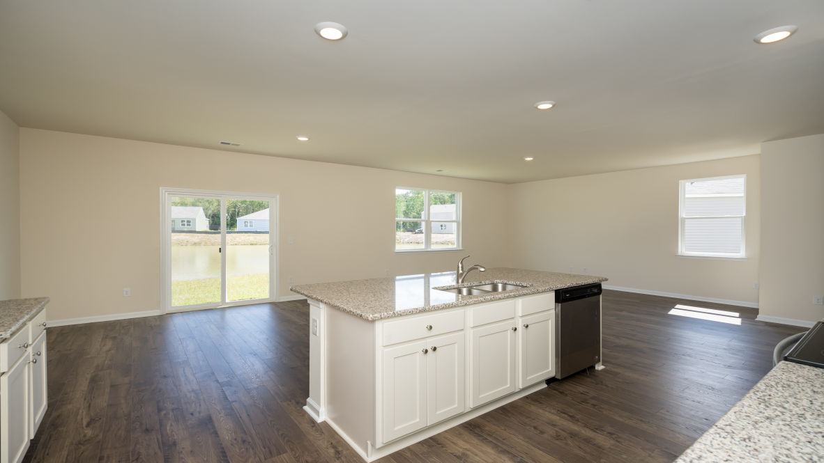 The kitchen features 36" cabinets, granite countertops, and stainless steel appliances, which are sure to both turn heads and make meal prep easy. Y