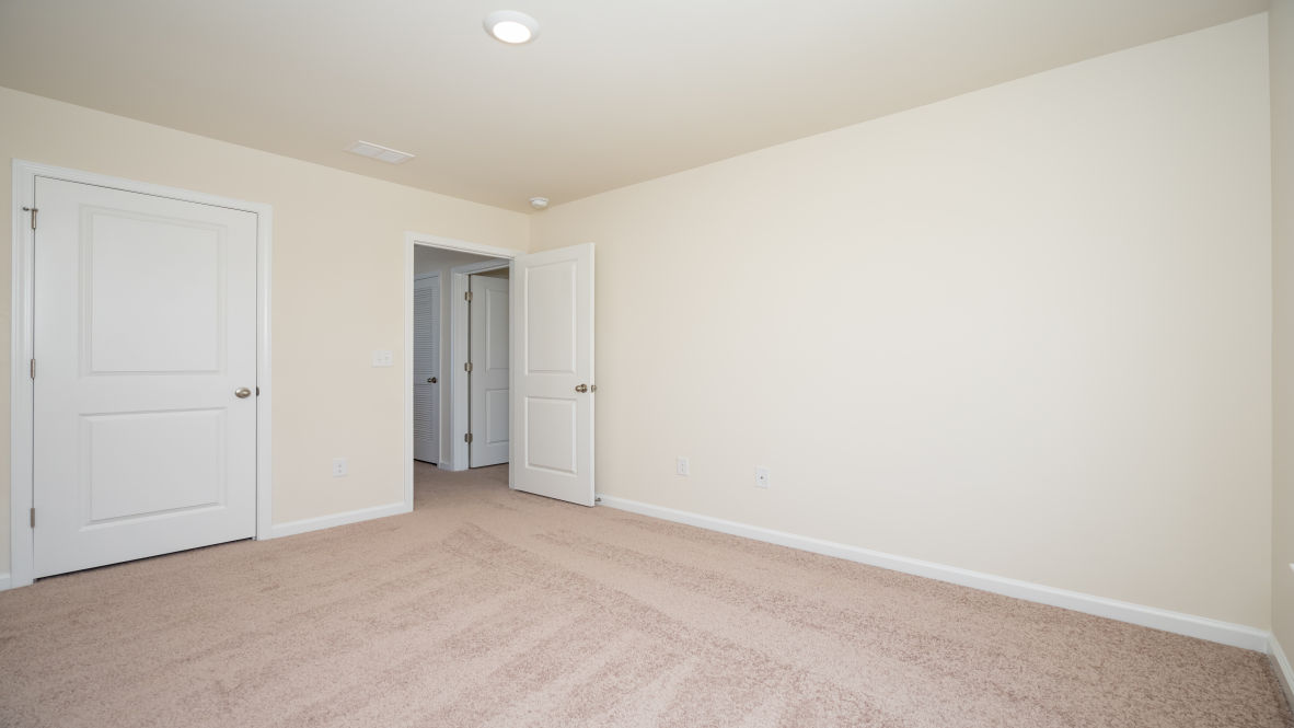 The primary bedroom has its own attached bathroom that features a walk-in closet and all the space you need to get ready in the morning.