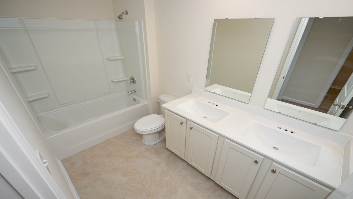 The primary bedroom has its own attached bathroom that features a walk-in closet and all the space you need to get ready in the morning.