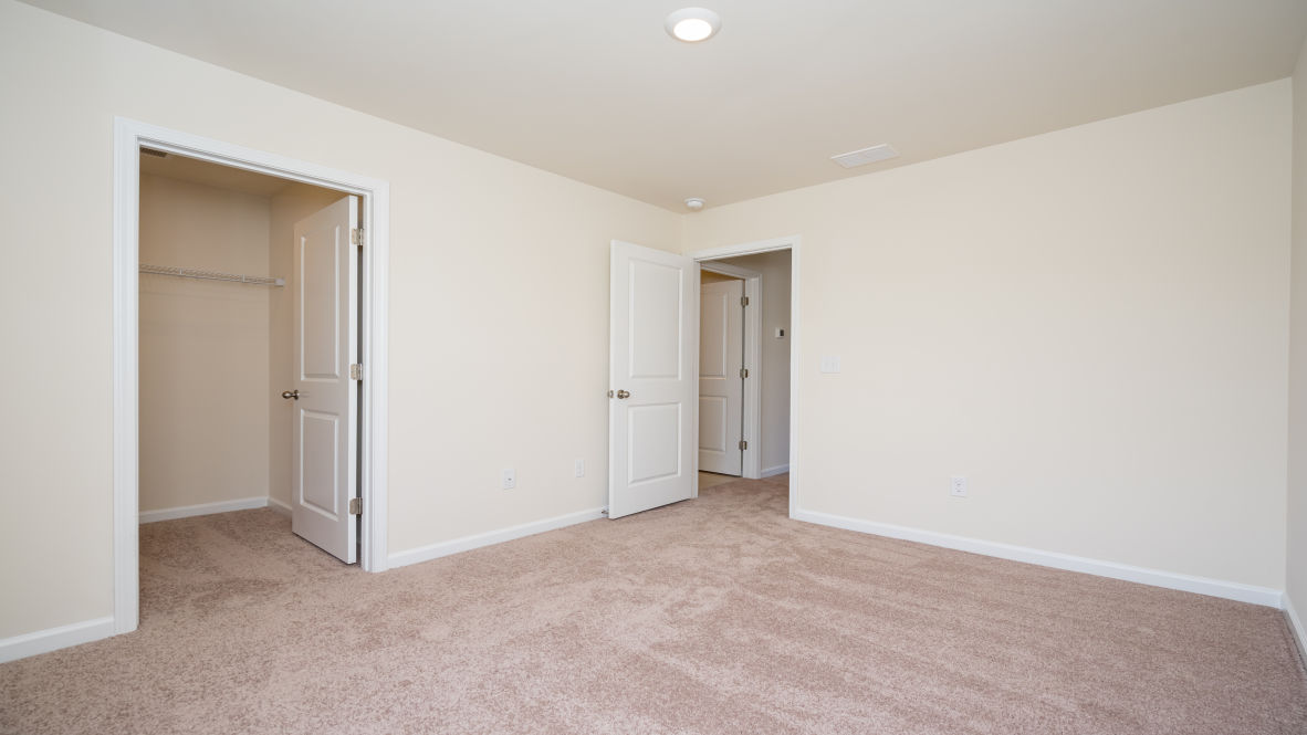 The primary bedroom has its own attached bathroom that features a walk-in closet and all the space you need to get ready in the morning.