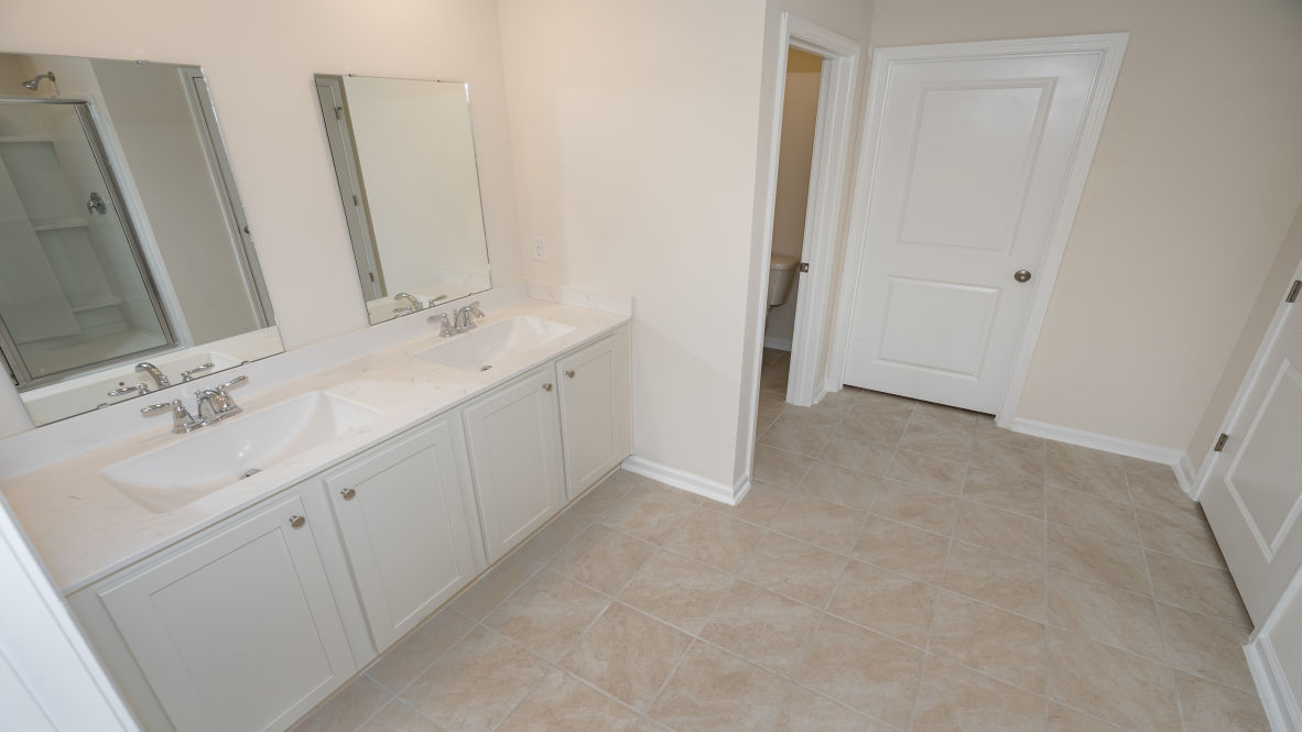 The primary bedroom has its own attached bathroom that features a walk-in closet and all the space you need to get ready in the morning.