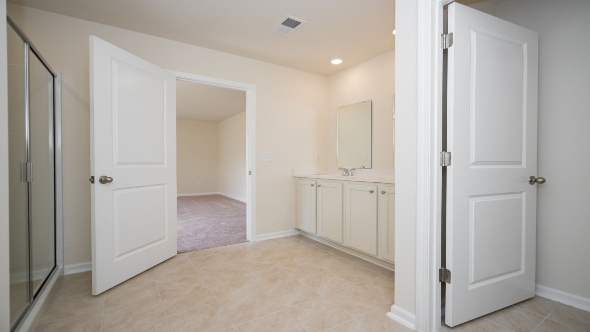 The primary bedroom has its own attached bathroom that features a walk-in closet and all the space you need to get ready in the morning.