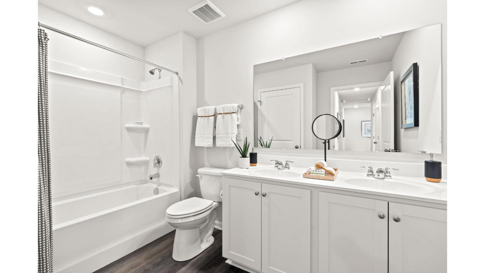The additional three spacious bedrooms allow for everyone to have privacy and share access to the second full bathroom