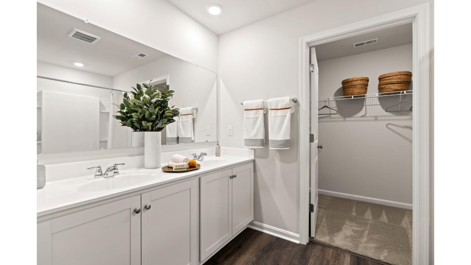 Upstairs you will find the primary suite complete with a private, double bowl vanity bathroom and two oversized walk-in closets.
