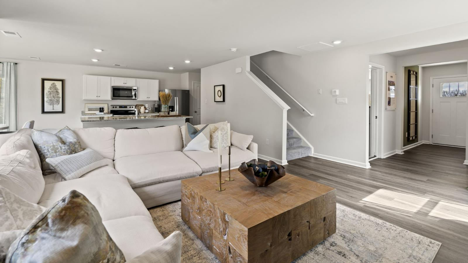A foyer with a powder room and coat closet greets you as you enter this home from the porch. The open floorplan allows you and your loved ones to spend quality time together while in the living room, casual dining area and kitchen.