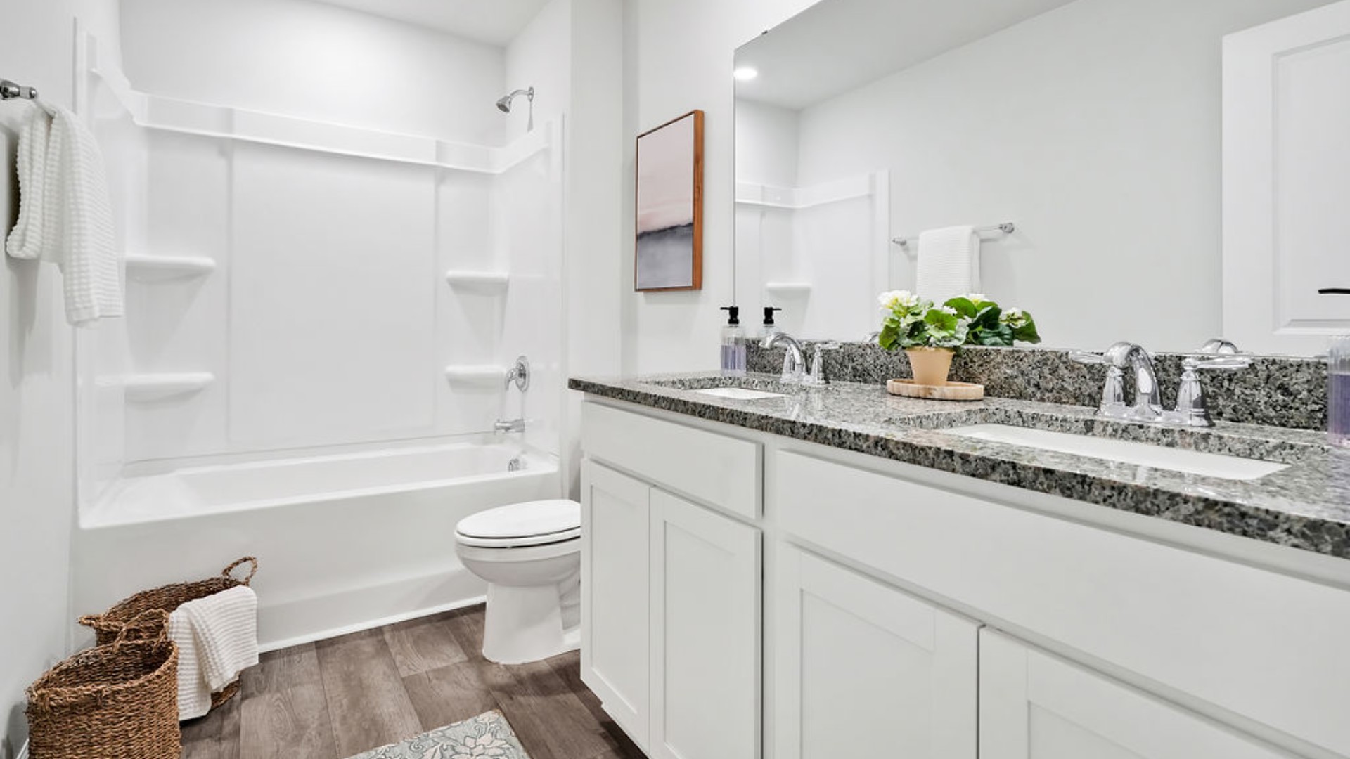 Upstairs, the Primary Suite offers a private bathroom, and the rest of the second floor includes three additional bedrooms and a convenient laundry room