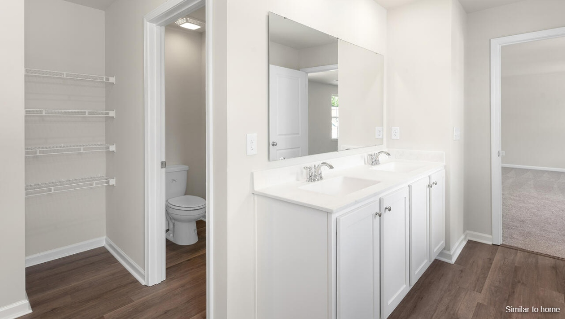 The primary bedroom has its own attached bathroom that features a walk-in closet and all the space you need to get ready in the morning.