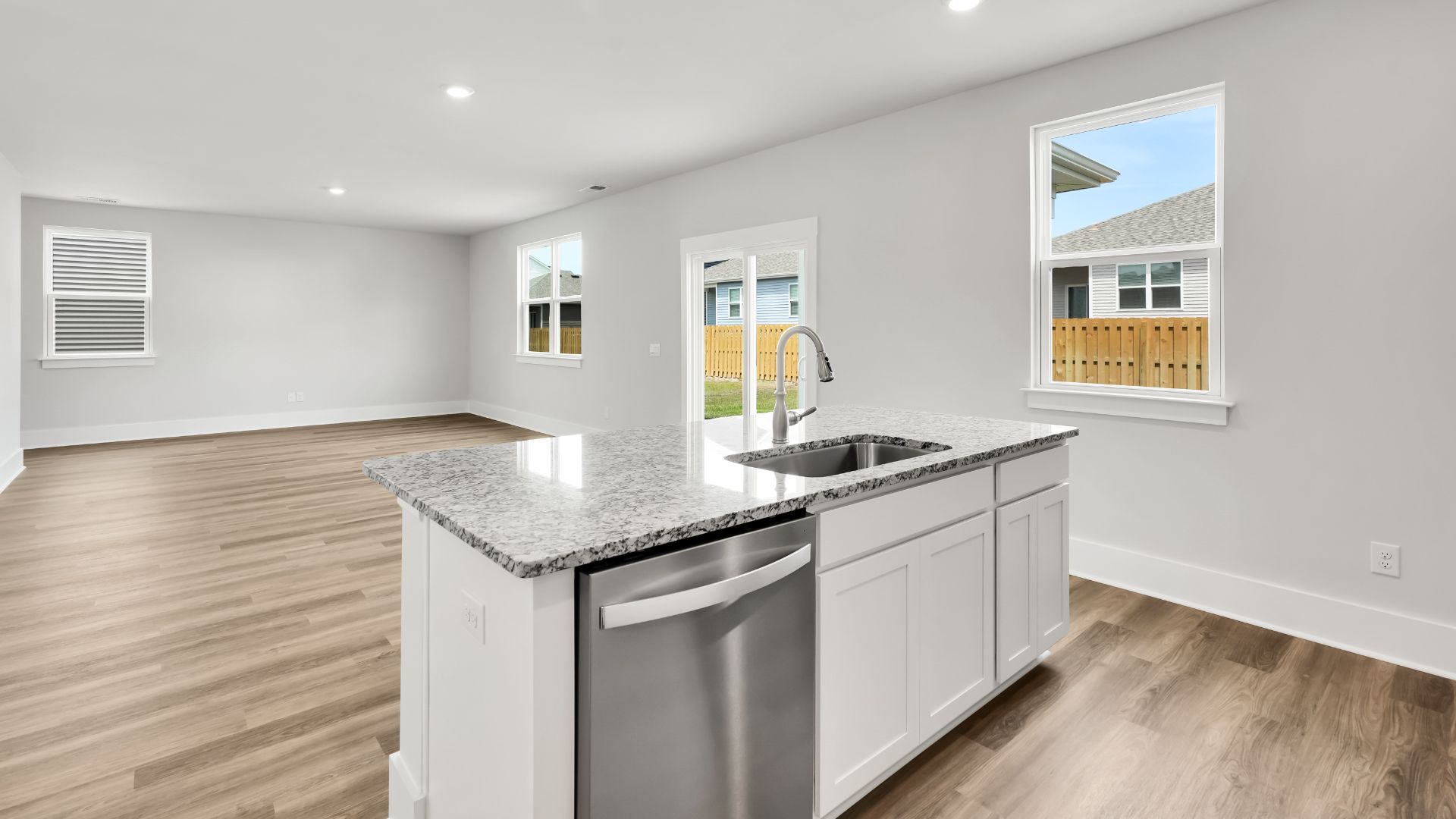 The kitchen features a large island and stainless steel appliances, which are sure to both turn heads and make meal prep easy. You’ll never be too far from the action with the living and dining area right there.