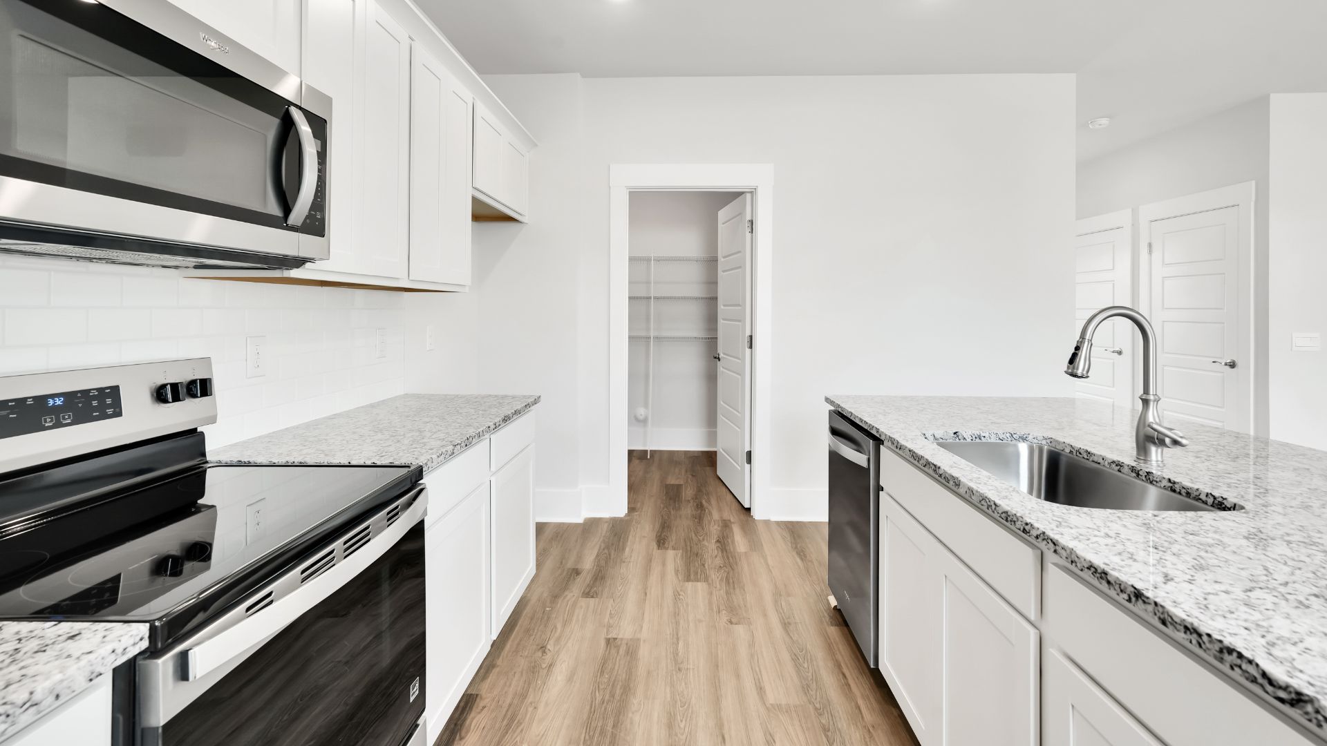 The kitchen features a large island and stainless steel appliances, which are sure to both turn heads and make meal prep easy. You’ll never be too far from the action with the living and dining area right there.