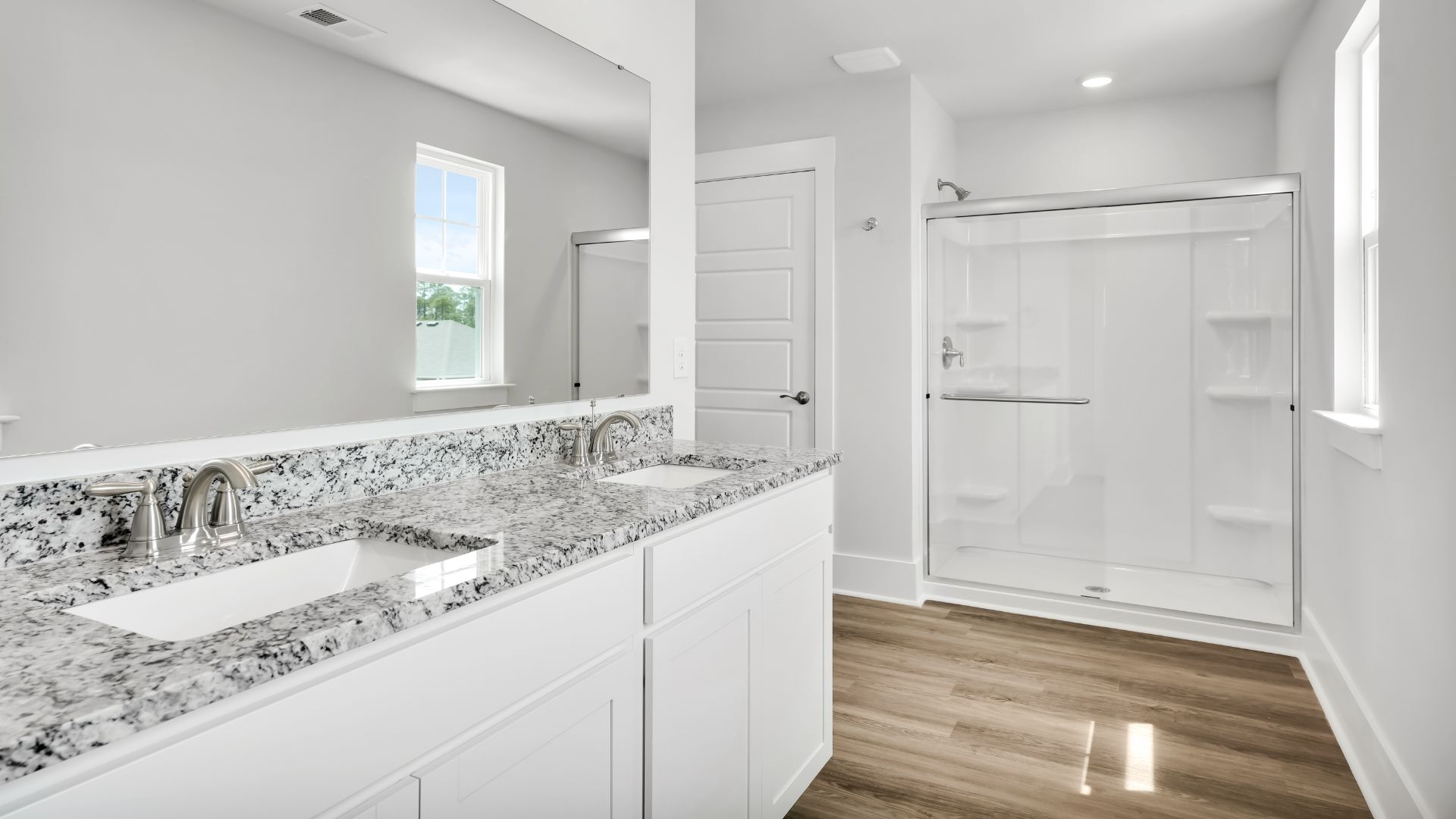 Upstairs, the primary bedroom has its own attached bathroom that features a walk-in closet and all the space you need to get ready in the morning. S