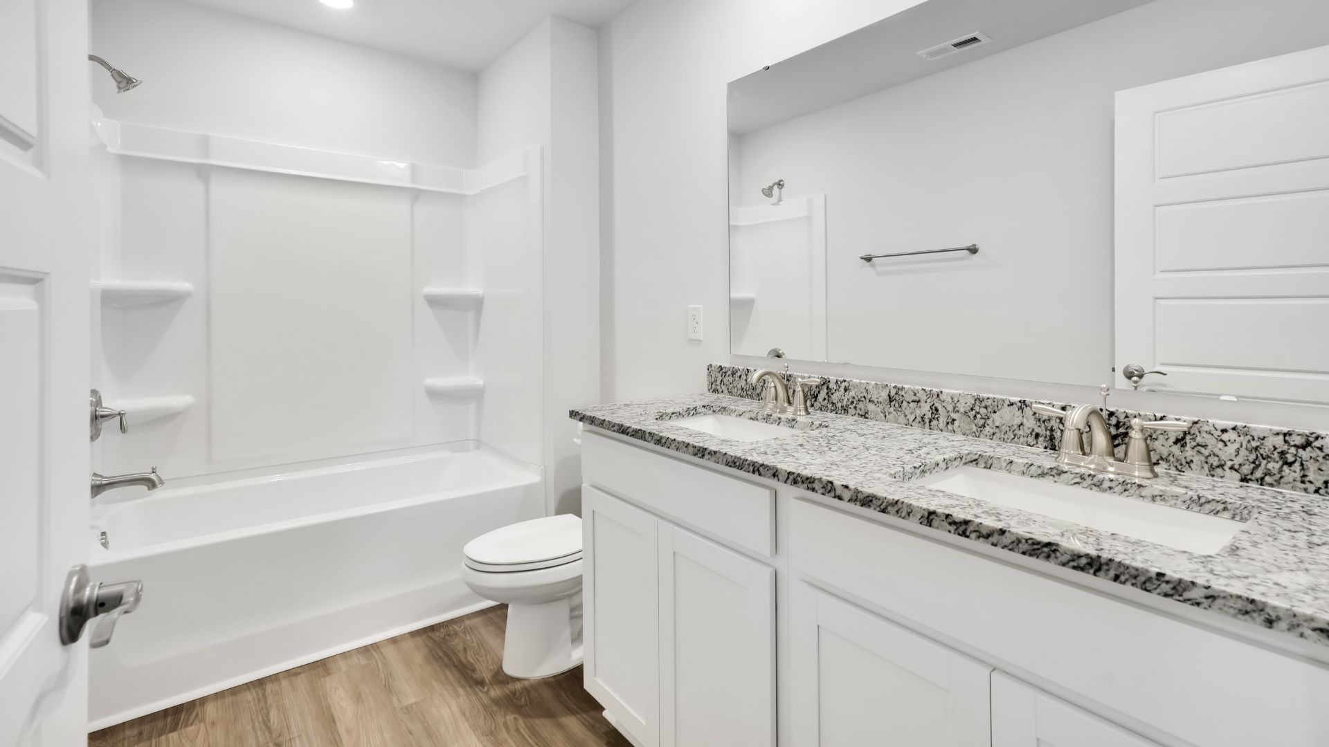 The rest of the second floor includes three additional bedrooms and a convenient laundry room