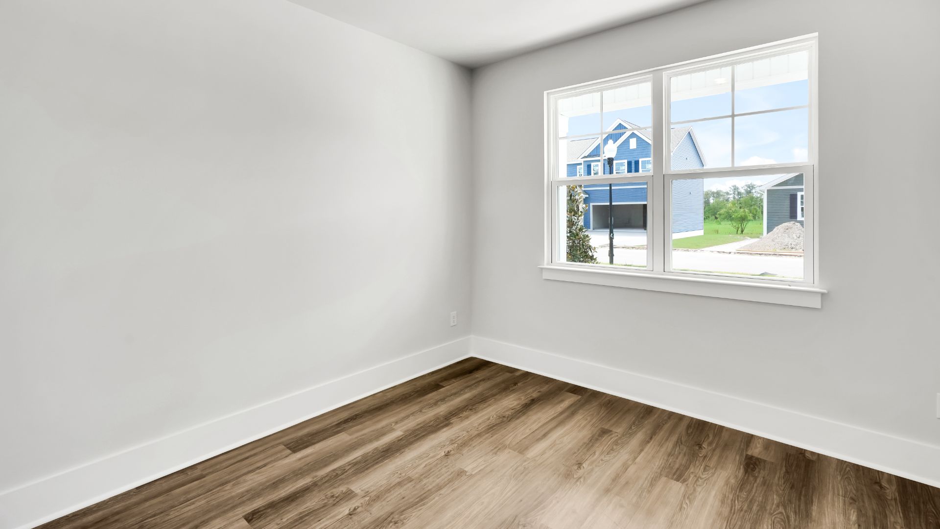 At the front of the home is a flex room and half bath.