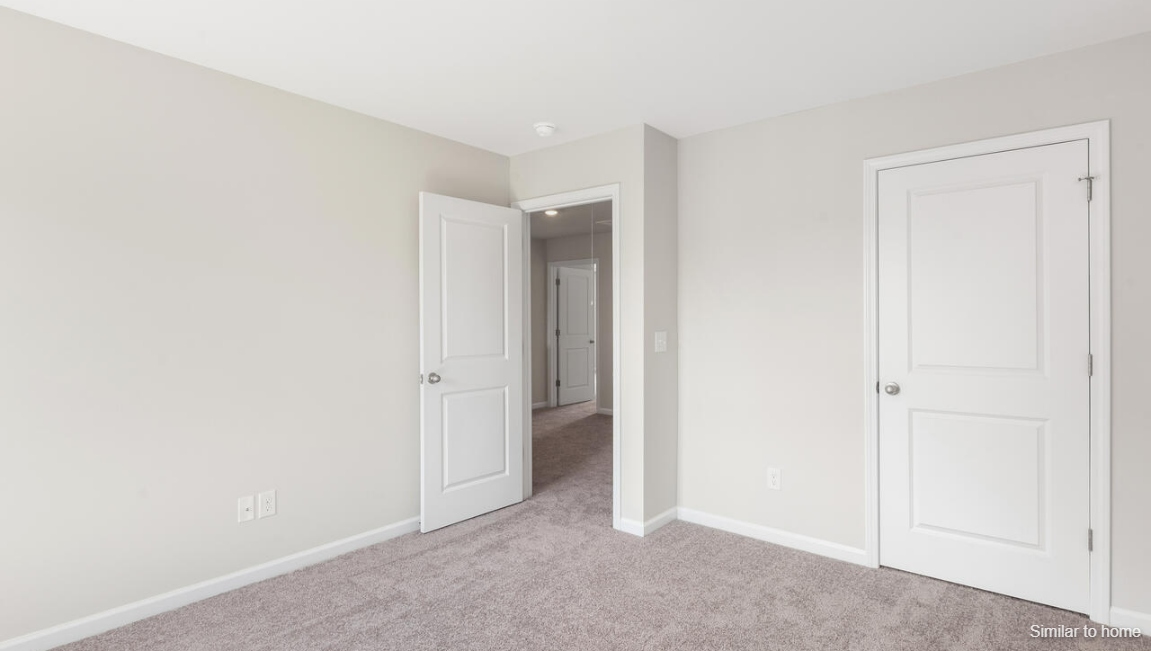Upstairs, the Primary Suite offers a private bathroom, and the rest of the second floor includes three additional bedrooms and a convenient laundry room.