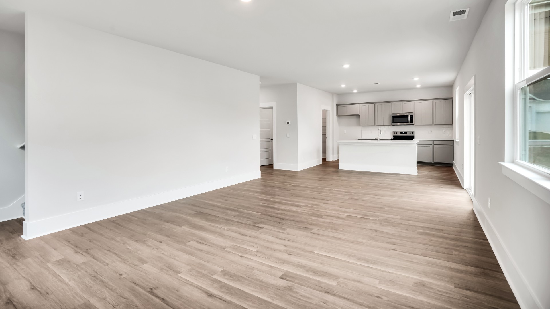 The living area is an open concept, where your kitchen, living, and dining areas blend seamlessly into a space perfect for everyday living and