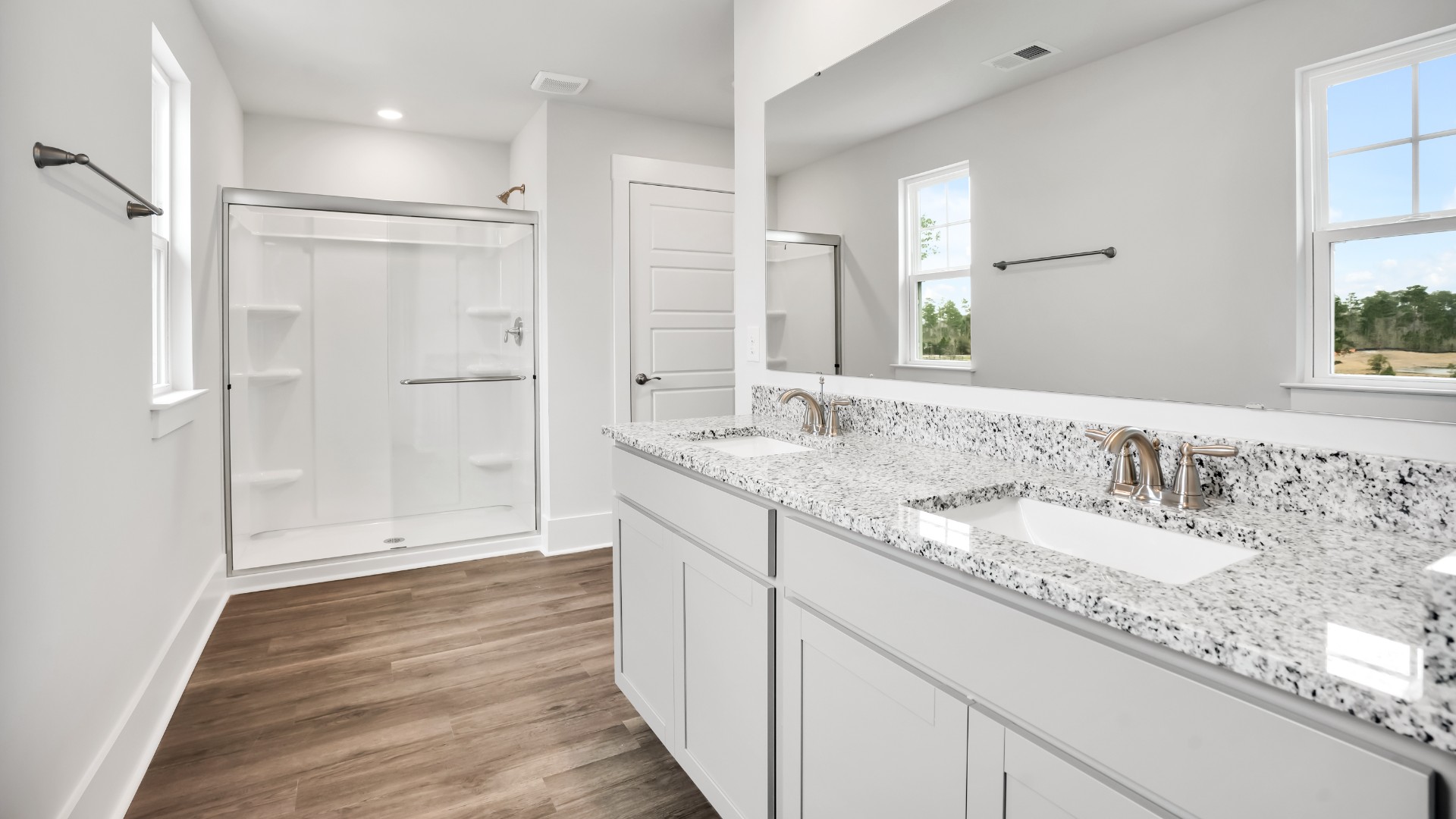 Upstairs, the primary bedroom has its own attached bathroom that features a walk-in closet and all the space you need to get ready in the morning.