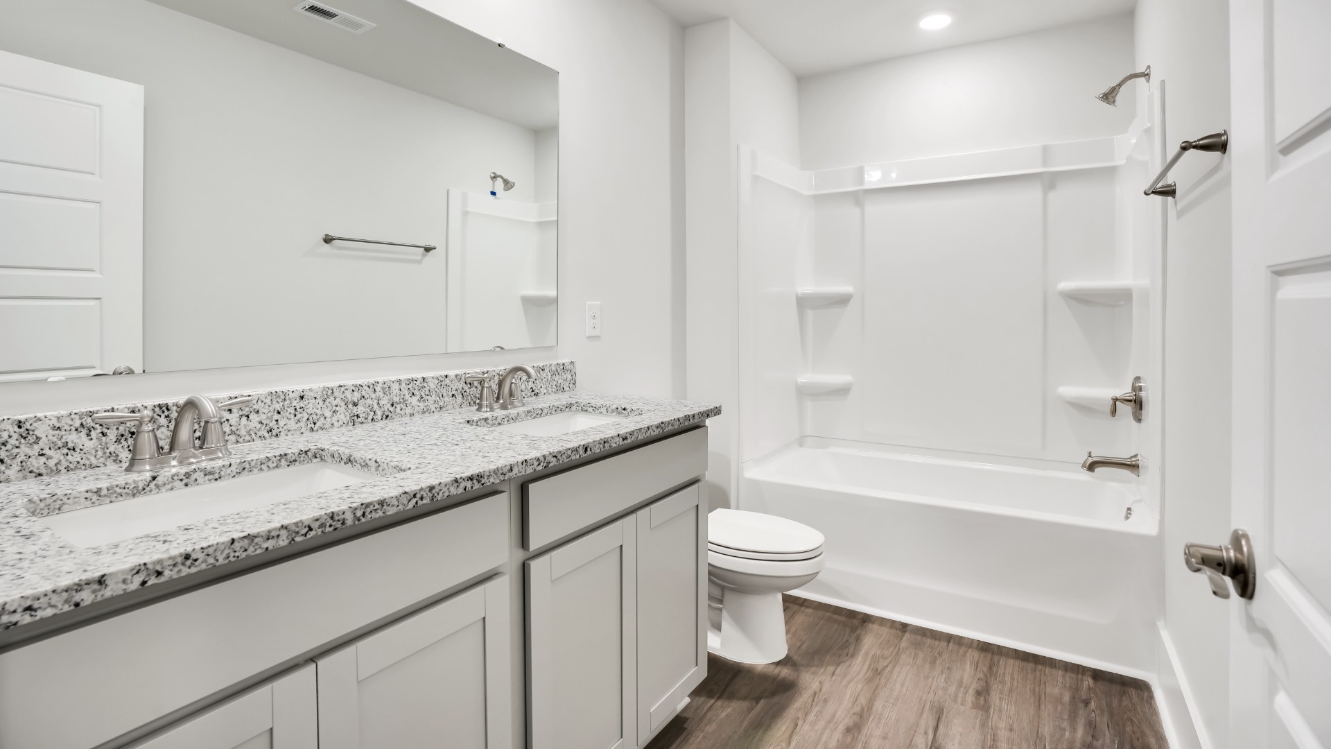 Upstairs, the primary bedroom has its own attached bathroom that features a walk-in closet and all the space you need to get ready in the morning.