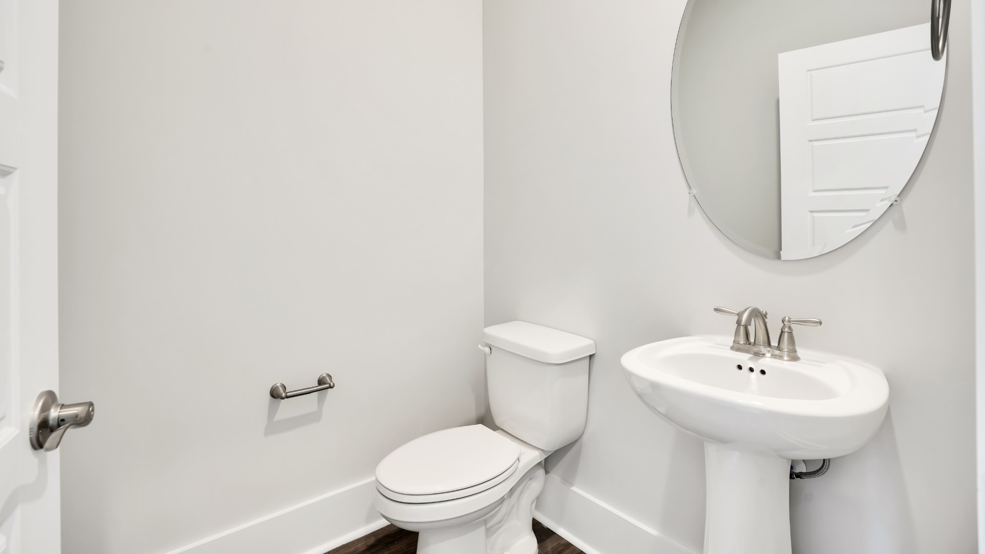 At the front of the home is a flex room and half bath.