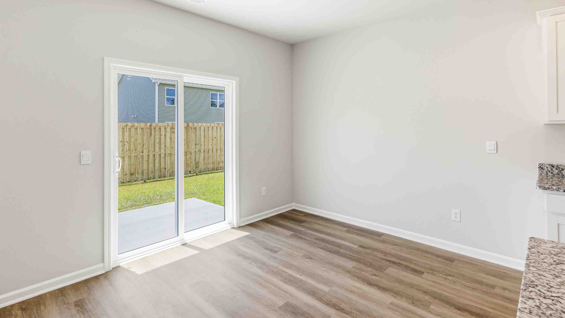 The open-concept kitchen features granite countertops and stainless steel appliances. The kitchen seamlessly connects to the dining and living areas, creating a great space for entertainment. Downstairs, a flex room can be used as an office or sitting area.