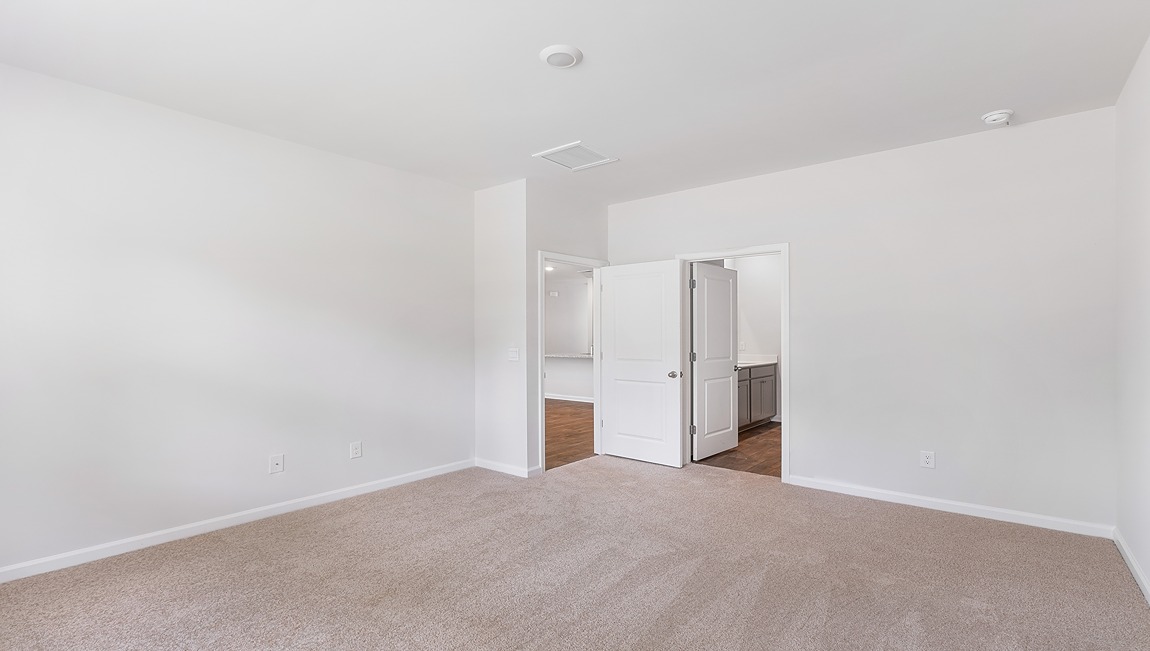 The primary bedroom has its own attached bathroom that features a walk-in closet and all the space you need to get ready in the morning. Sharing a sink isn’t a worry with the double vanity, and you also get additional privacy with a separate door for the toilet and shower.