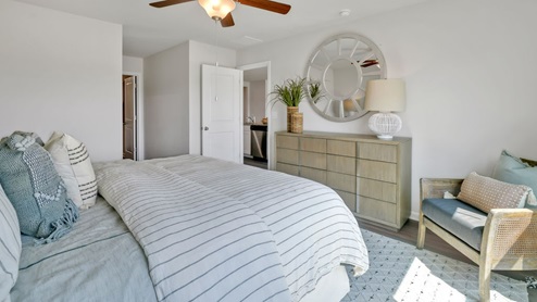 The Primary Suite offers a massive closet and a luxurious bathroom with a walk-in shower, linen closet, and dual vanity.