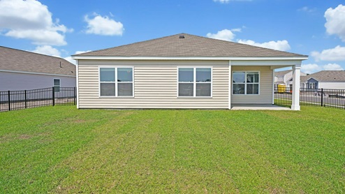 Enjoy the covered porch perfect for entertaining and enjoying the Carolina evenings.