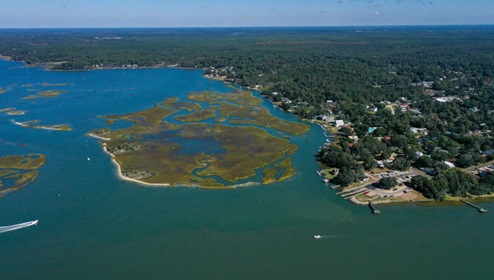 Situated in the heart of South Brunswick County, this rapidly expanding area lies just south of Wilmington, drawing people who appreciate a rural small-town vibe. Renowned for its stunning beaches, the region is a haven for water sports enthusiasts. Boaters can reach Sunset Harbor Boat Ramp in just 6 minutes.