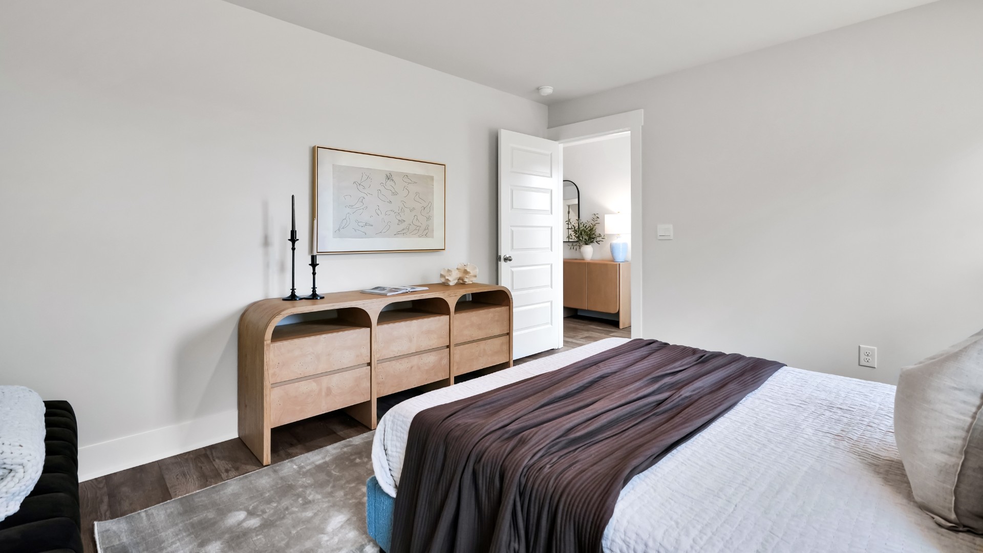 Bedroom One, located at the back of the house for privacy, also has a suite bathroom with double vanity and walk-in closet.