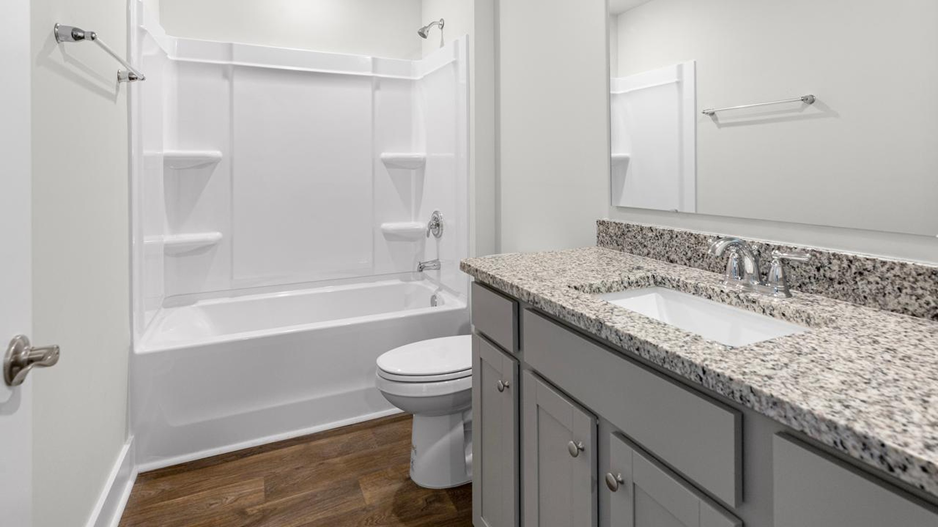 At the front are two guest bedrooms and a full bathroom, perfect for visitors or a home office.