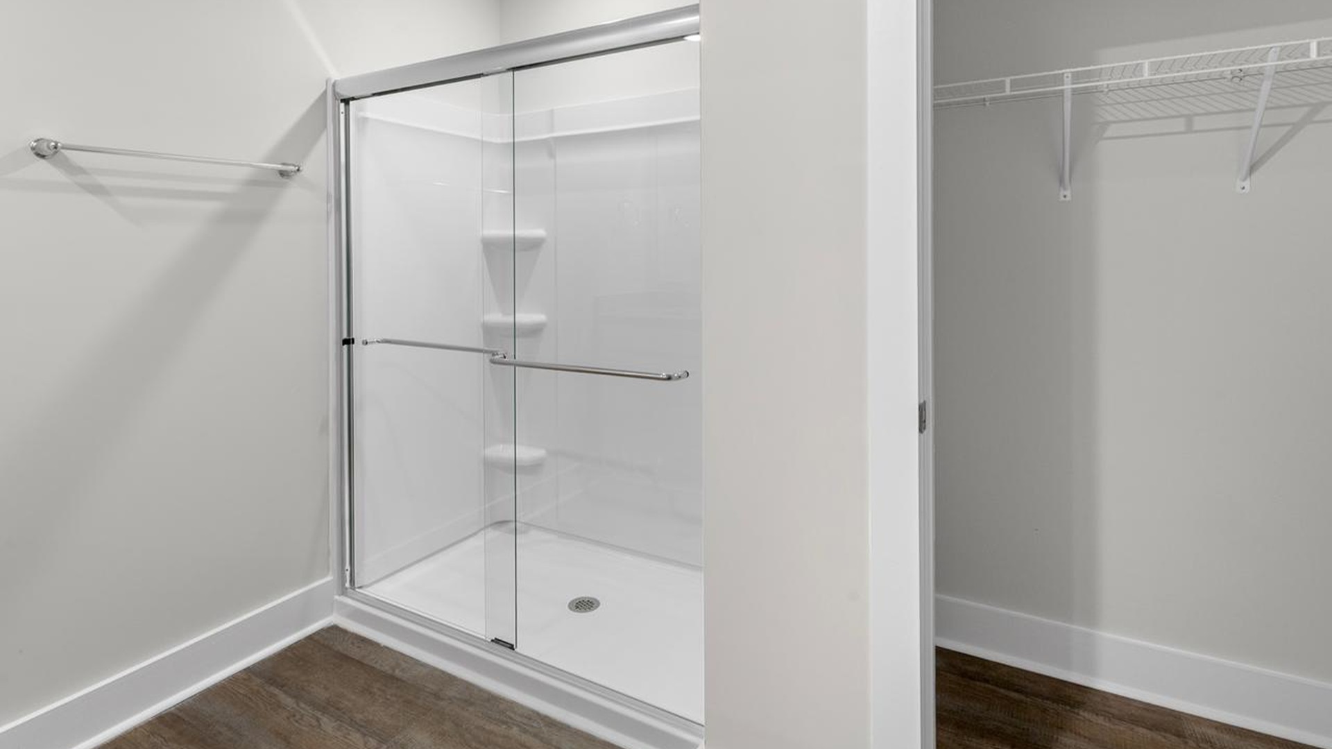 The primary suite offers a massive closet and a luxurious bathroom with a walk-in shower, linen closet, and dual vanity.