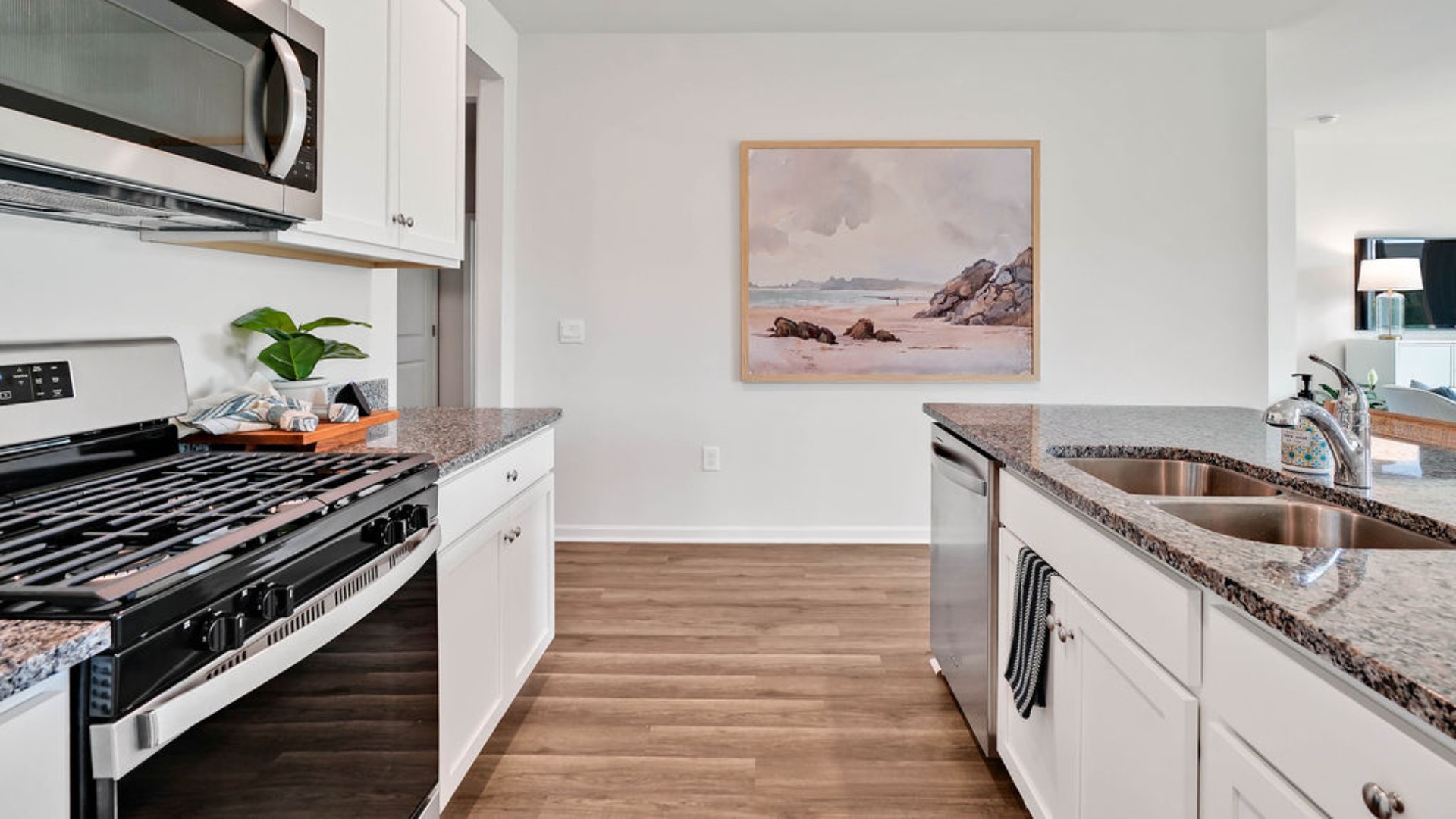 The kitchen features beautiful cabinets, granite countertops, and stainless-steel appliances, which are sure to both turn heads and make meal prep easy. You’ll never be too far from the action with the living and dining area right there.