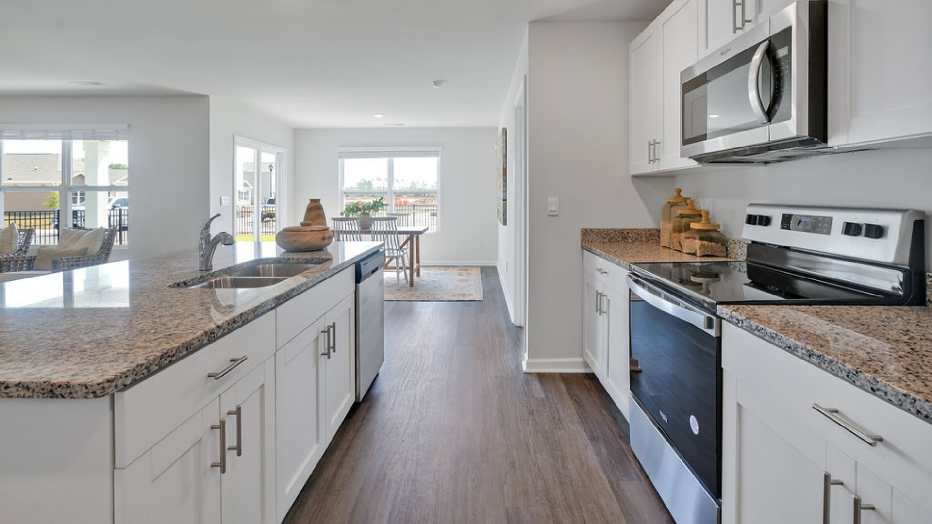 Its centerpiece is the showstopper kitchen, featuring a large island, stainless steel appliances, and a spacious pantry.
