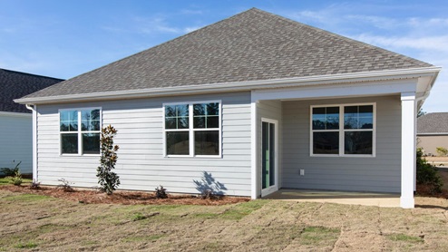 Community of Brunswick Forest in Leland NC. r Aria floor plan is complete with granite kitchen countertops, a counter height oversized kitchen island, quartz bathroom counters