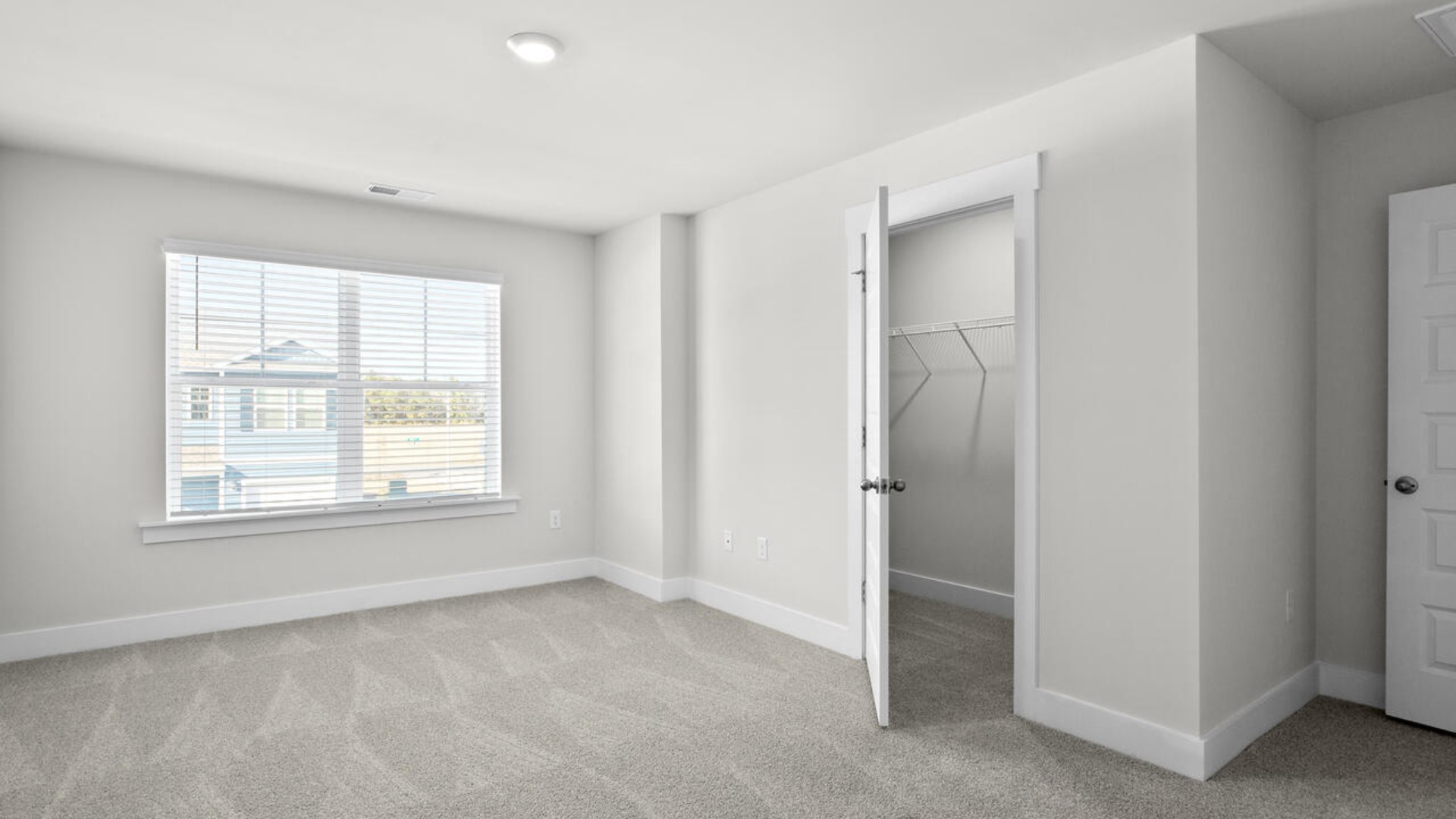 Upstairs, the spacious primary suite includes a walk-in closet and dual-vanity bathroom. Two additional bedrooms, a shared full bath, and a conveniently located laundry room complete the second level.