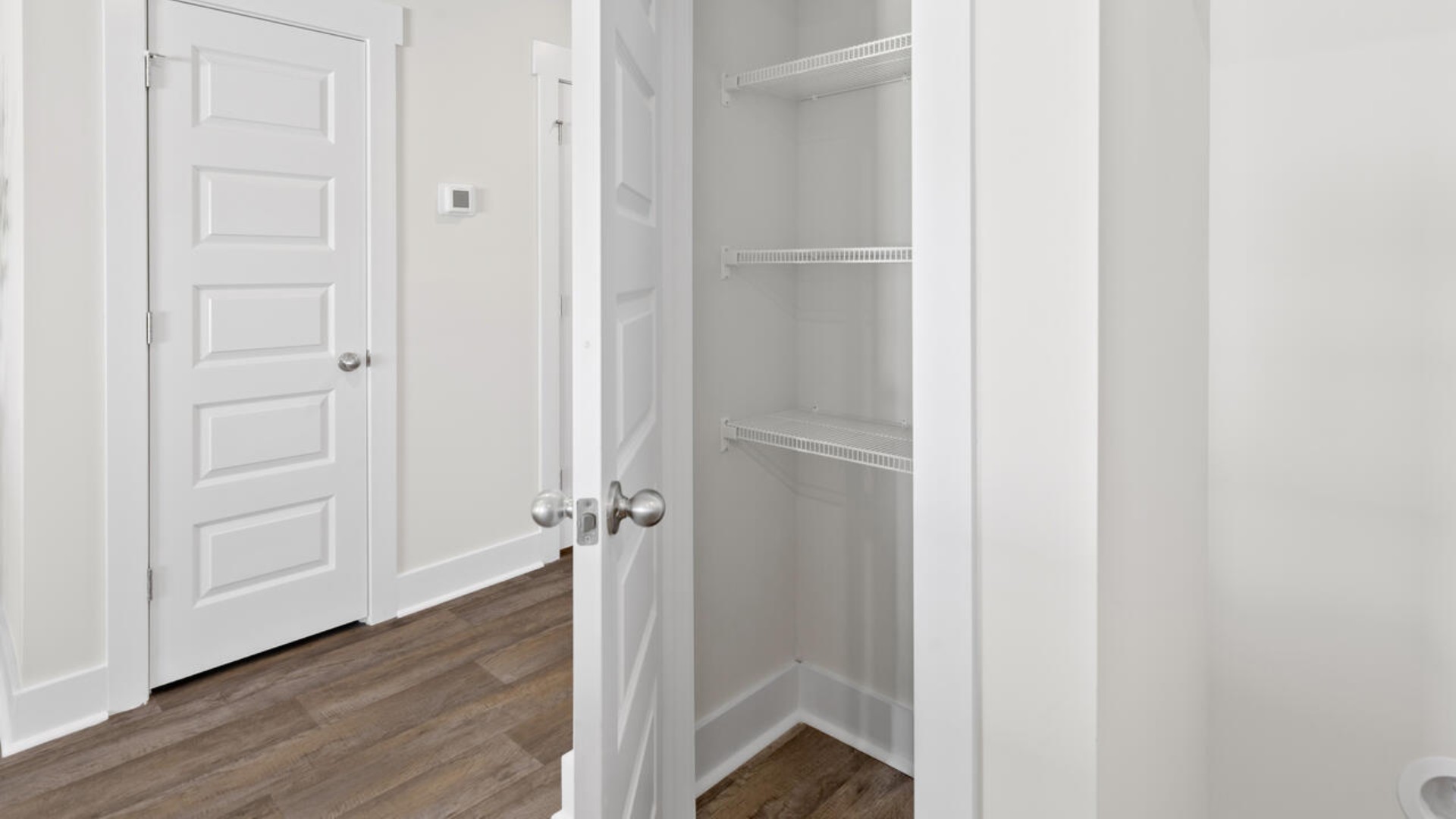 The kitchen overlooks the dining and living spaces and is equipped with stainless-steel appliances and granite countertops, making it easy to stay connected while preparing meals