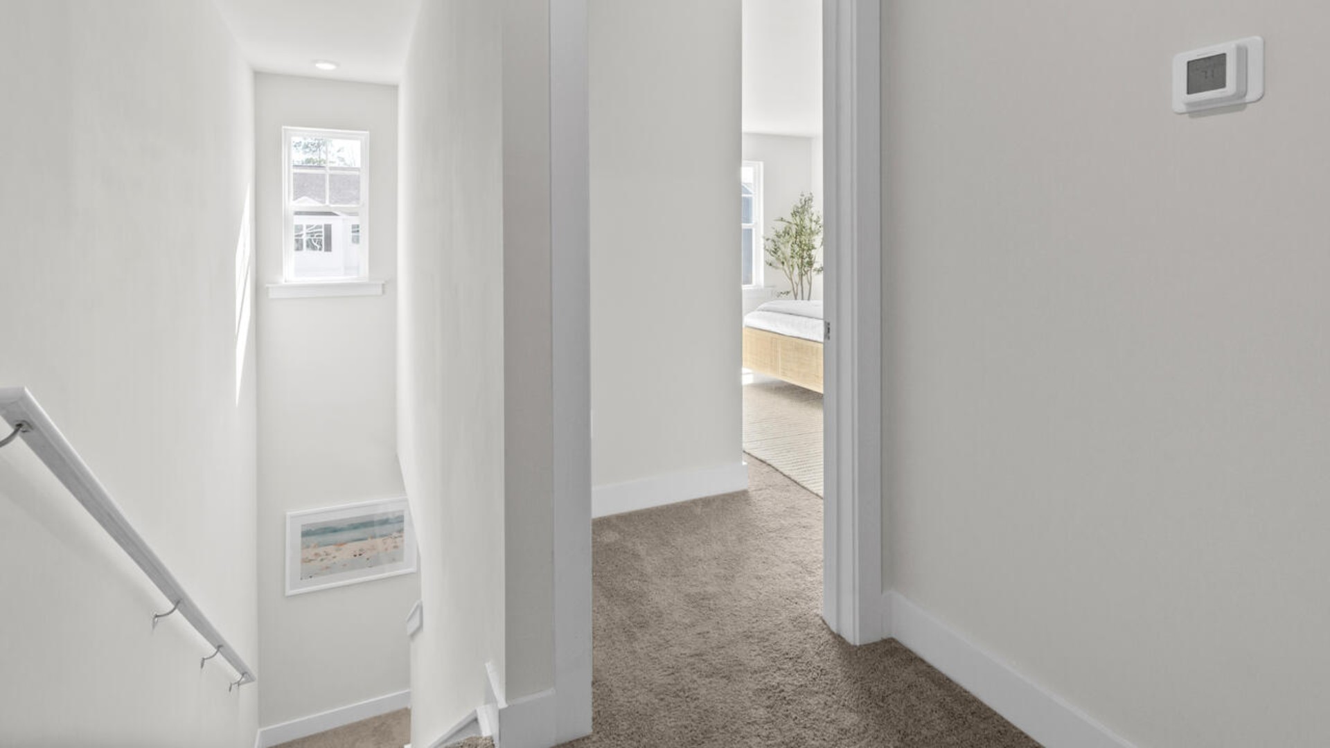 Upstairs, the spacious primary suite includes a walk-in closet and dual-vanity bathroom. Two additional bedrooms, a shared full bath, and a conveniently located laundry room complete the second level.
