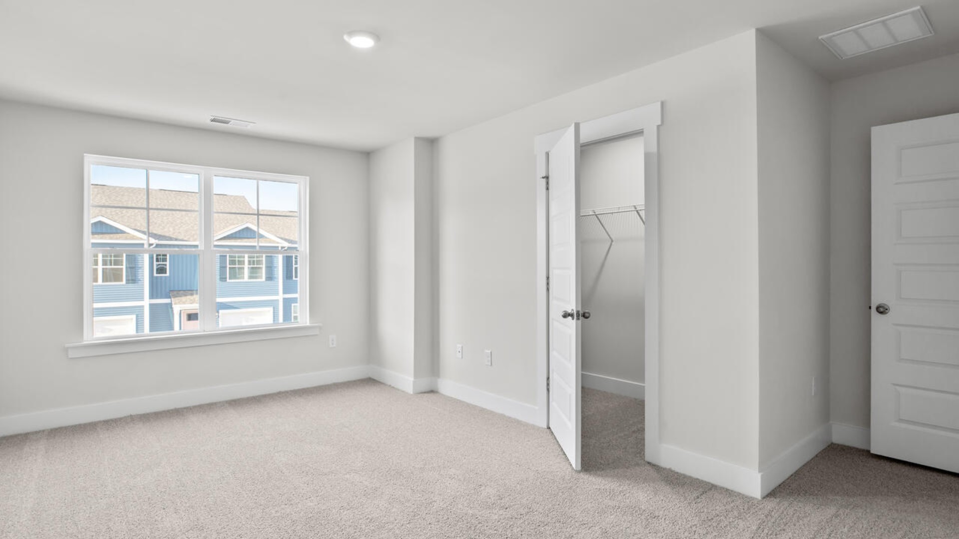 The second floor features the primary bedroom with a walk-in closet and double vanities