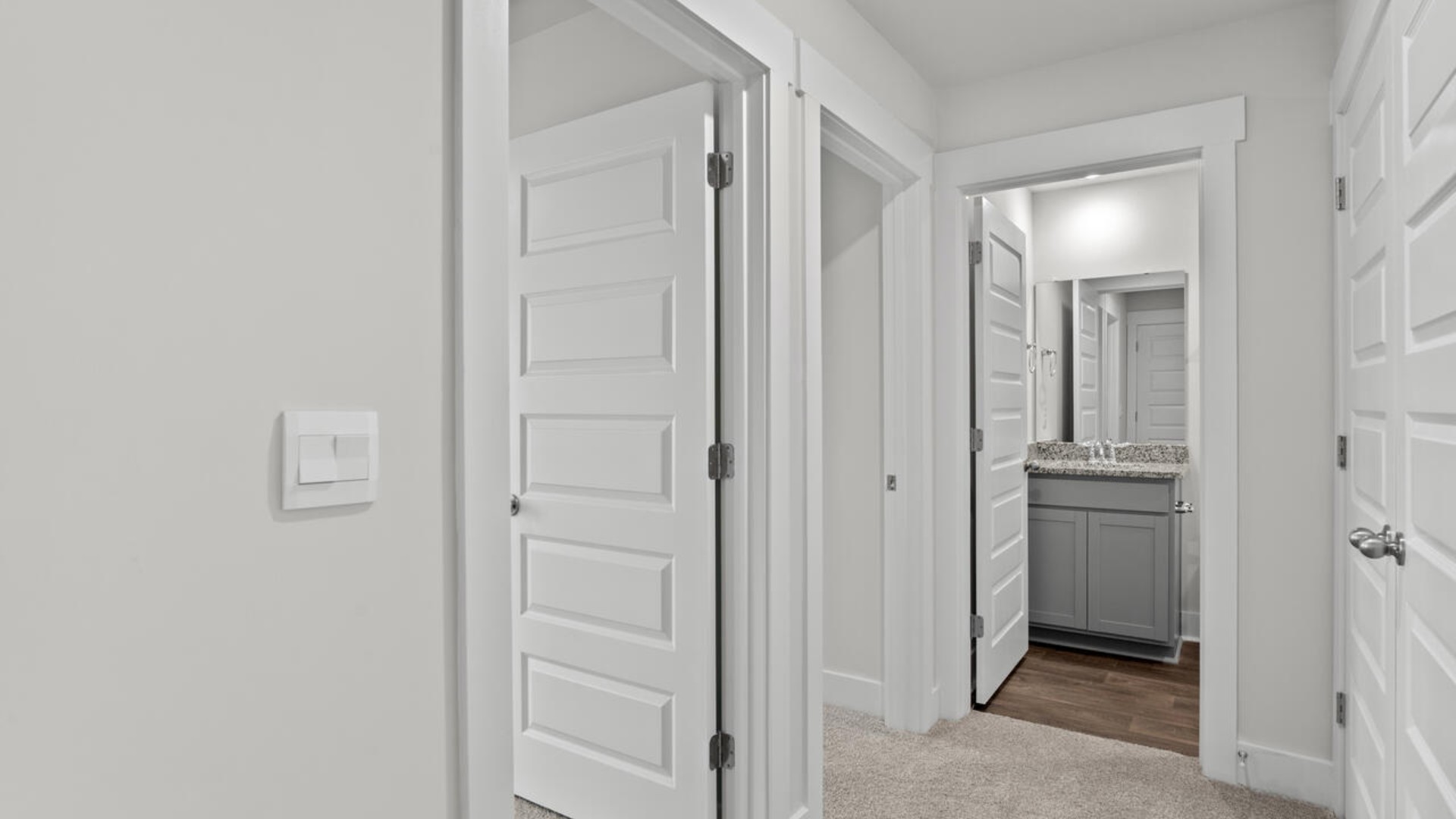 The second floor features the primary bedroom with a walk-in closet and double vanities. It also includes two additional bedrooms, a shared bathroom, and a laundry room for convenience. The bathrooms are equally elegant, featuring matching granite and a primary suite with a glass shower that feels like your own personal spa.