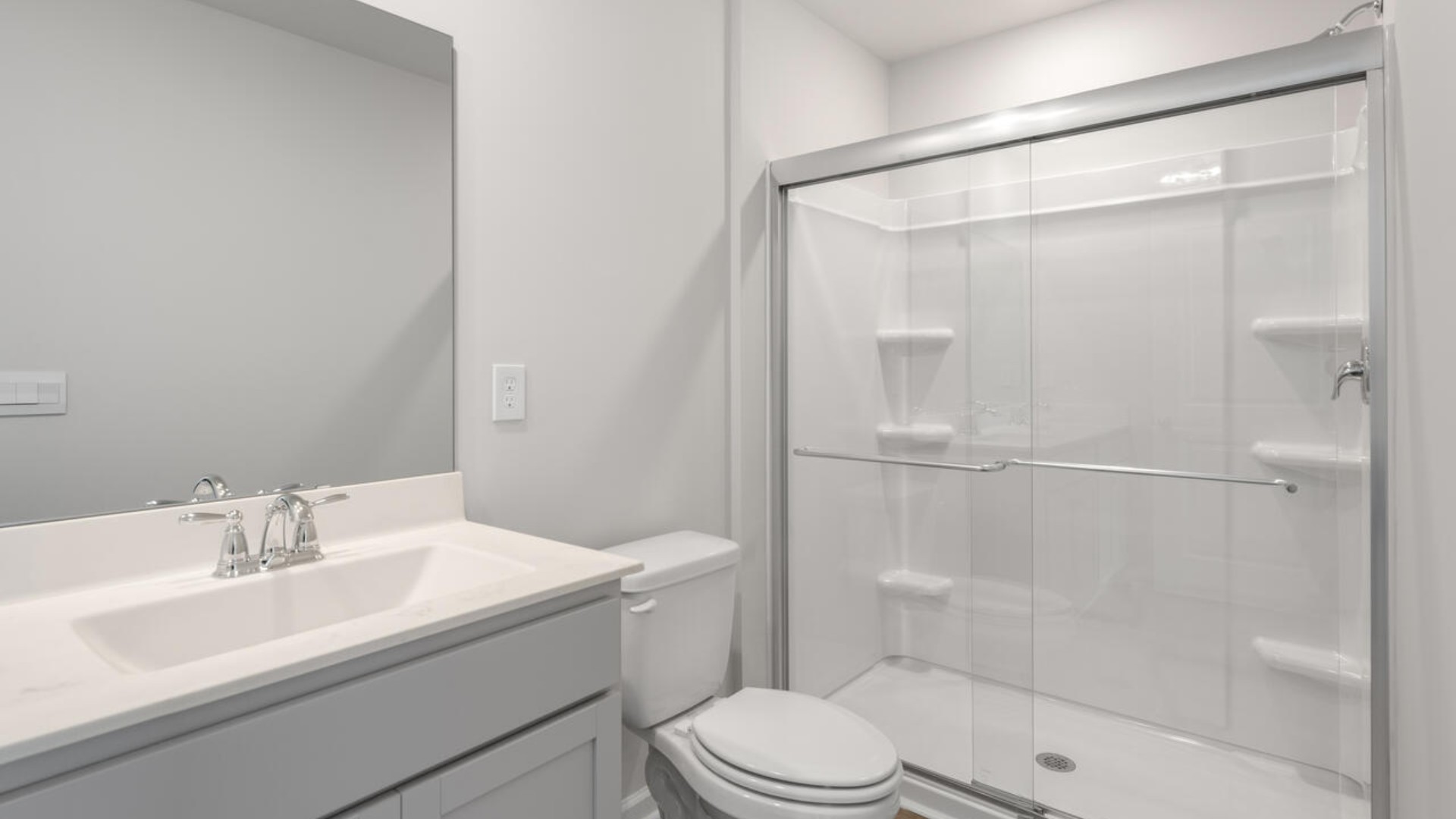 The second floor features the primary bedroom with a walk-in closet and double vanities. It also includes two additional bedrooms, a shared bathroom, and a laundry room for convenience. The bathrooms are equally elegant, featuring matching granite and a primary suite with a glass shower that feels like your own personal spa.