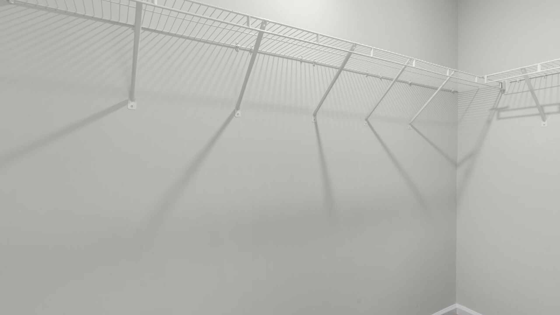 The second floor features the primary bedroom with a walk-in closet and double vanities. It also includes two additional bedrooms, a shared bathroom, and a laundry room for convenience.