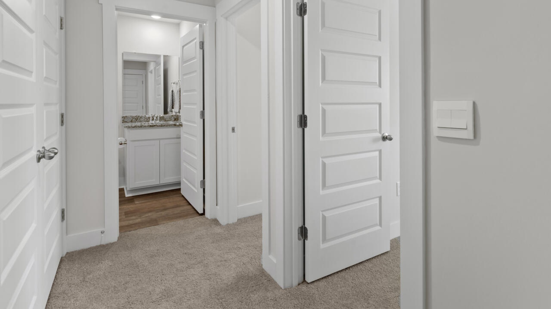he second floor features the primary bedroom with a walk-in closet and double vanities.
