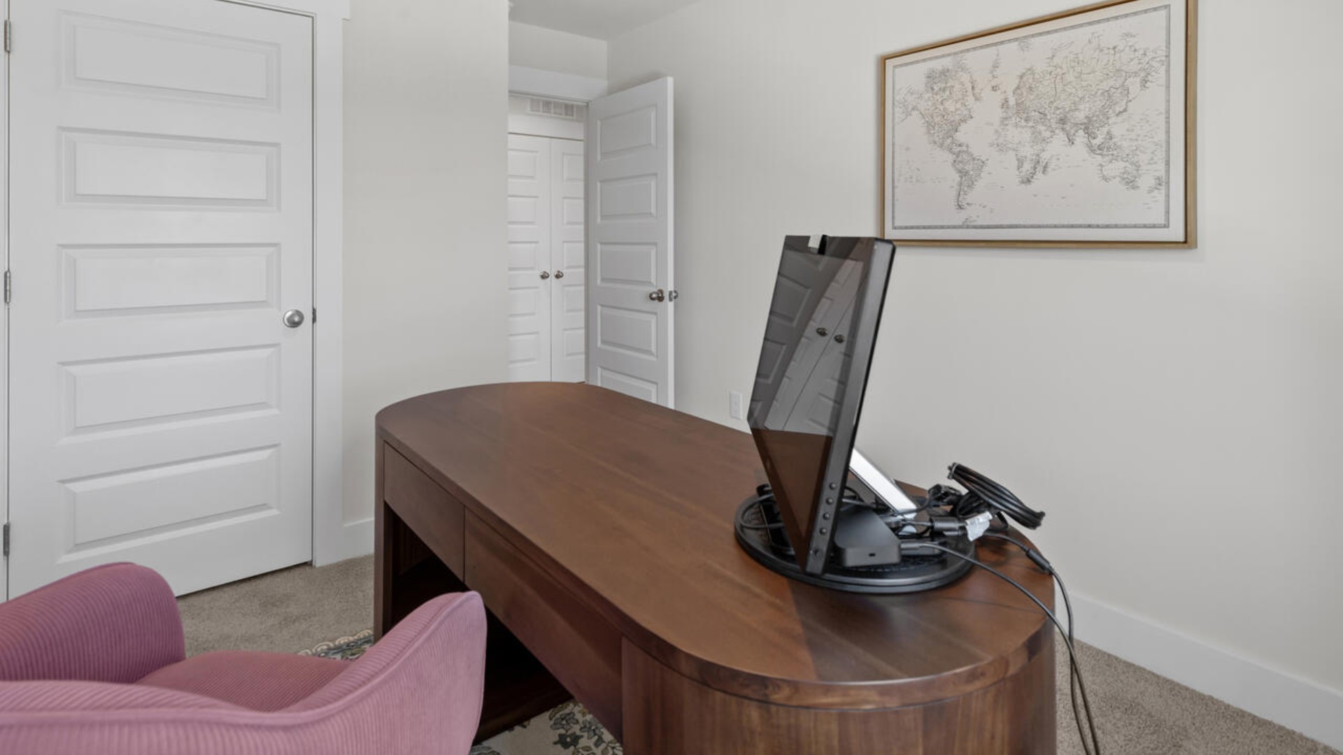 . It also includes two additional bedrooms, a shared bathroom, and a laundry room for convenience. The bathrooms are equally elegant, featuring matching granite and a primary suite with a glass shower that feels like your own personal spa.