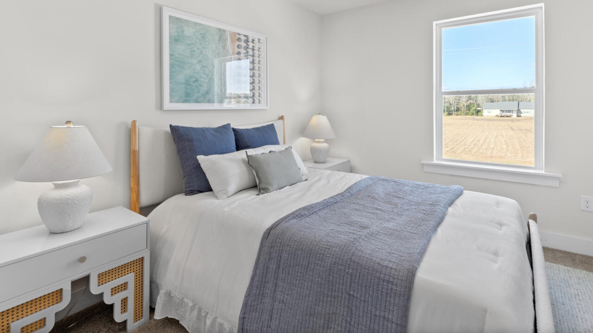 . It also includes two additional bedrooms, a shared bathroom, and a laundry room for convenience. The bathrooms are equally elegant, featuring matching granite and a primary suite with a glass shower that feels like your own personal spa.